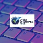 cyber essentials plus assessor logo over purple keyboard